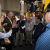 Doug Oberhelman, Caterpillar chairman and CEO, talks with visitors to Cat's CONEXPO 2014 exhibit.