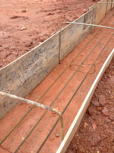 Herbert Construction Co. uses a plastic footing forming system to prepare this footing for concrete placement.
