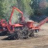 The integrated loader on this Morbark 1300G tub grinder provides a good view down to the mill.