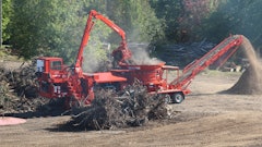 The integrated loader on this Morbark 1300G tub grinder provides a good view down to the mill.