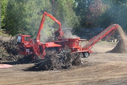 The integrated loader on this Morbark 1300G tub grinder provides a good view down to the mill.