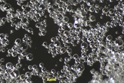 Microspheres are dispersed in a liquid admixture solution for ease of dispensing and mixing in concrete.