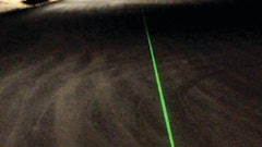 LaserLine can attach to any striping machine and gives the operator a spot reference for a line, or an actual line, when used at night.