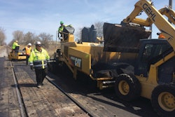 The material utilized in between the rails varies depending on local traffic volumes. In heavier industrial areas, the railroad will often spec a sturdier material such as wood.