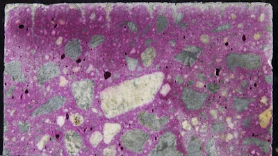 Figure 5: Photograph of phenolphthalein stained surface showing plastic shrinkage cracks. (The scale is in millimeters.)