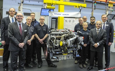 Perkins president Ramin Younessi, front right, joins representatives from across the business to celebrate the production of the 20 millionth Perkins engine.