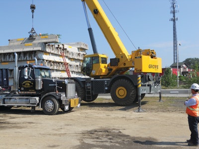The Grove RT880E performed a variety of tasks including moving the highway’s barrier walls to set up lane structures and construction zones.