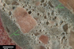 Figure 1: Reflected light photomicrograph of polished surface showing dark, low w/cm mortars (green bars) coating aggregate particles. These are typical indicators of retempering.