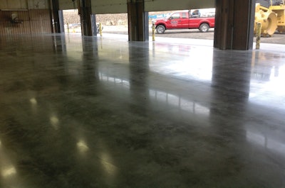 Pictured is the completed service bay at Western States Equipment Company after cleaning with the autoscrubber and before applying the FirstPolish, step three.