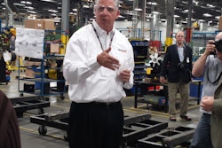 Terry Dolan, executive vice president of commercial and industrial products at Generac, speaks to a crowd of media representatives at the company's Oshkosh plant on May 7.
