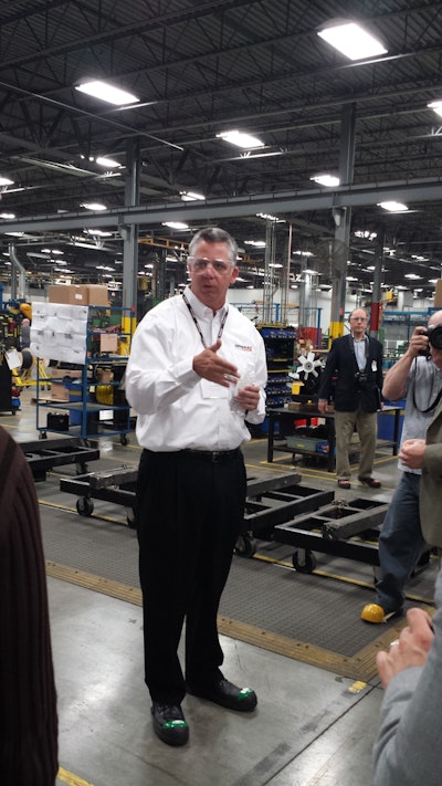 Terry Dolan, executive vice president of commercial and industrial products at Generac, speaks to a crowd of media representatives at the company's Oshkosh plant on May 7.