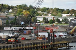 A Manitowoc 2250 operated as a Berminghammer Drill, which is used to drill overburden that consists of marine sediment, small boulders, and rock sockets; to bore through steel debris; and to position temporary falsework frames. Two Manitowoc 12000s operated as support cranes on the site.