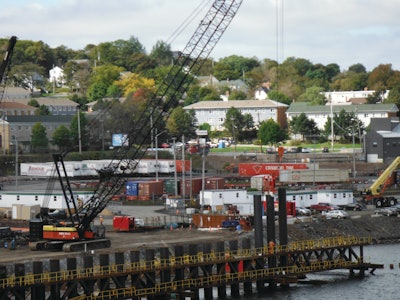 A Manitowoc 2250 operated as a Berminghammer Drill, which is used to drill overburden that consists of marine sediment, small boulders, and rock sockets; to bore through steel debris; and to position temporary falsework frames. Two Manitowoc 12000s operated as support cranes on the site.