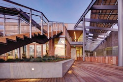 The JCVI facility consists of a three-story, 28,600-square-foot office wing and a single-story, 12,605-square-foot laboratory wing. The laboratory and office wings are perched atop the roof/podium deck of the partially below-grade parking garage.