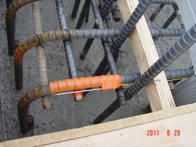 Place temperature sensors at center of the mass concrete and at a depth of two-inches from the center of nearest exterior surface. Take readings every hour and compare concrete temperature and temperature difference to specified maximum limits every 12 hours.