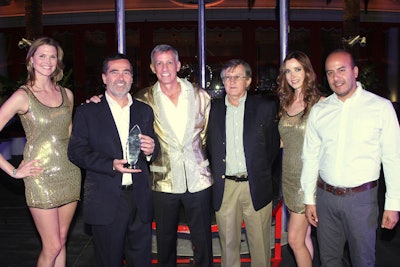Felipe Kreis, Erwin Hoehmann, and Uriel Olivera of BEKA S.A. receives the award for International Spare Parts and Pipe System Distributor of the Year from Putzmeister President & CEO Dave Adams.