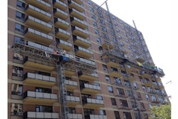 The demolition crew on the project included five men on a mast climber along with the Brokk 50 machine. One man operated the machine and the other moved debris and prepared the steel joists.