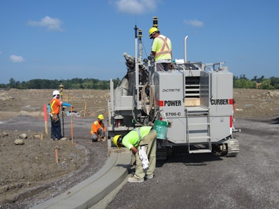 There was six miles of curbs throughout the development that TACC carved out and fine graded them with 3/4-inch stone as prep for the asphalt paver and placed the concrete curb and gutter using its Power Curber 5700-C with Topcon Millimeter GPS machine control.