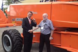 Company owner Gordon McGruer (right) with JLG Industries’ Karel Huijser (left).