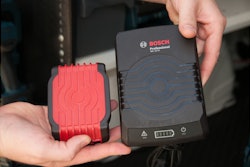 Bosch’s new induction charging system for tool batteries includes a charging pad (right) and a battery (left) that includes a coil of wire located just under the red plastic bottom of the battery. No mechanical connection required.
