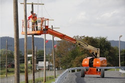 Mock poles and power lines help trainees at JLG's new McConnellsburg proving grounds practice maneuvering booms in tight spaces, identify voltage on a power line and determine the minimum safe working distance.