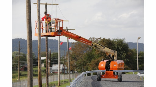 Mock poles and power lines help trainees at JLG's new McConnellsburg proving grounds practice maneuvering booms in tight spaces, identify voltage on a power line and determine the minimum safe working distance.