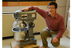 Xianming Shi with the industrial size mixer he uses to concoct green deicers and ice-free pavement.