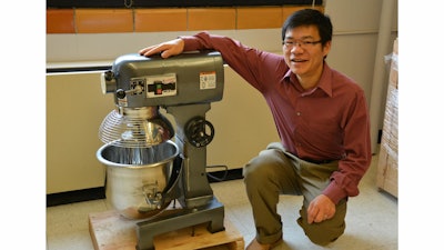 Xianming Shi with the industrial size mixer he uses to concoct green deicers and ice-free pavement.