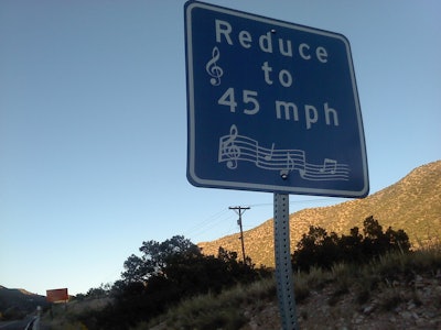 Musical rumble strip 'How to' sign.