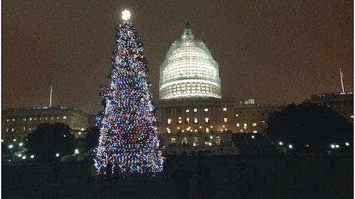 Aaron Urban, a 10-year-old from Maryland, lights the U.S. Capitol Christmas Tree at a special ceremony at the U.S. Capitol. Urban was diagnosed with a brain tumor four years ago, and it was his wish to light the Capital tree.