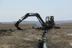 A Volvo ECR88 D-Series excavator fitted with unique swamp pads is working in the Connecticut coastal wetlands for the Wetlands Habitat and Mosquito Management (WHAMM) Program.