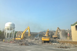 Demolition contractor Yannuzzi Group mobilized an arsenal of hydraulic excavators, loaders, end dumps and concrete crushers to help with the demolition and asbestos remediation of this one-million-square-foot former naval storage facility.