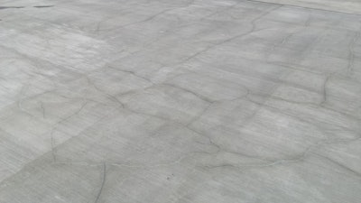 Random cracks in reinforced slabs caused by thermal contraction and drying shrinkage are not longitudinal cracks and typically do not increase the risk of reinforcement corrosion in concrete.