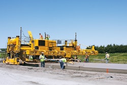 A two-track GHP-2800 slipform paver with Topcon mmGPS 3D guidance system slipforms a new bypass around the city of Columbus, Neb.