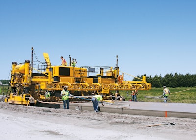 A two-track GHP-2800 slipform paver with Topcon mmGPS 3D guidance system slipforms a new bypass around the city of Columbus, Neb.
