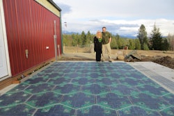 Julie & Scott Brusaw in front of their Solar Roadway parking lot prototype.