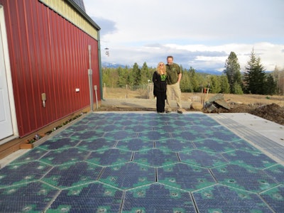 Julie & Scott Brusaw in front of their Solar Roadway parking lot prototype.