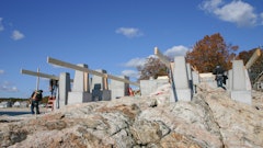 Building the foundation for house on rock is no easy thing. Shown here are the footing pads and piers. Workers are beginning to form the concrete deck which will become the floor of the house.