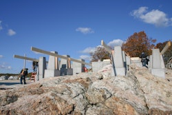 Building the foundation for house on rock is no easy thing. Shown here are the footing pads and piers. Workers are beginning to form the concrete deck which will become the floor of the house.