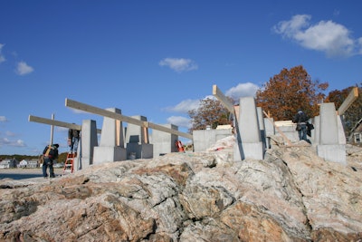 Building the foundation for house on rock is no easy thing. Shown here are the footing pads and piers. Workers are beginning to form the concrete deck which will become the floor of the house.