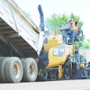 Schlouch Inc. replaced two of its asphalt pavers with new Caterpillar AP555E tracked models (such as the one shown) and featuring extended warranties. The replacements cut the company's paving costs significantly.