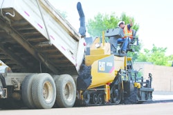 Schlouch Inc. replaced two of its asphalt pavers with new Caterpillar AP555E tracked models (such as the one shown) and featuring extended warranties. The replacements cut the company's paving costs significantly.