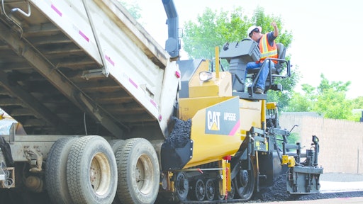 Schlouch Inc. replaced two of its asphalt pavers with new Caterpillar AP555E tracked models (such as the one shown) and featuring extended warranties. The replacements cut the company's paving costs significantly.