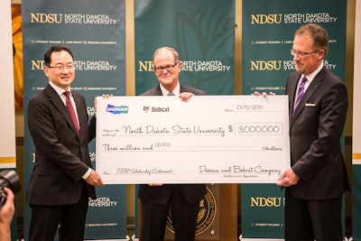 Doosan and Bobcat Company present a check to North Dakota State University signifying their share of the scholarship endowment contribution of $3 million.