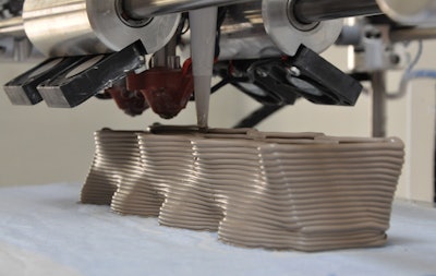 3D printing is done using super-size printers which use a special concrete and composite mixture that is thicker than regular concrete, allowing it to be self-supporting as it sets.