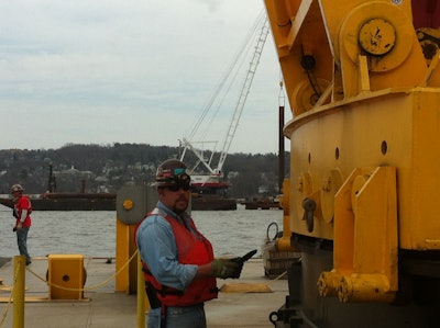 Chris Chartrey, a Traylor Bros. equipment superintendent, uses an iPad form to inspect a crane on the Tappan Zee bridge job on the Hudson River. Inspecting equipment as it leaves and arrives on sites helps Traylor assign excessive wear directly to the work that causes it, so future bids can accommodate the cost.