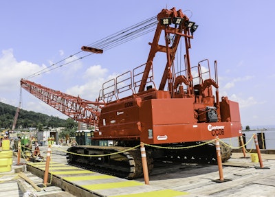 The 110-ton-capacity Manitowoc 11000-1 was erected on a trestle, where it loads and unloads supplies from barges working along the waterway, plus is used as an accessory crane.