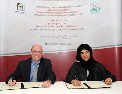 Lionel Lemay, senior vice president of NRMCA (left) and Eng. Hawa Bastaki, executive director of DCL-DM, (right), met for a signing ceremony in Dubai, United Arab Emirates, to establish a cooperative agreement to recognize technical equivalencies of their respective concrete plant and truck certification programs.