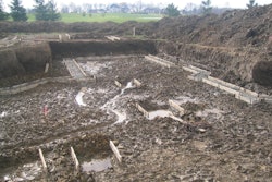 Spring rains left this foundation with standing water in the excavation. Concrete placements should take place promptly before saturation of the grade occurs.