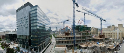 Upon completion in 2016, the 21-story main building of the massive, Montreal University Health Centre will provide more than 1,145,000 square feet of floor space and deliver 772 single-bed rooms.